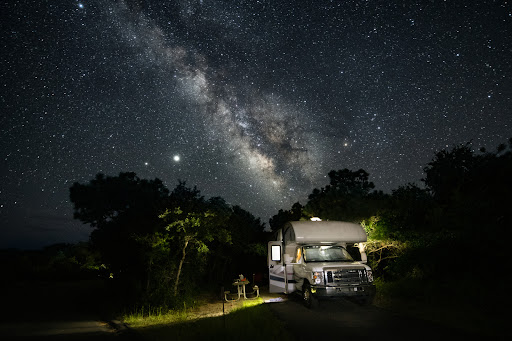 An off-grid RV enthusiast boondocking under the stars