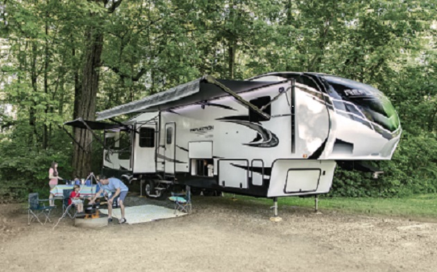 family outside their Grand Design Reflection 5th Wheel