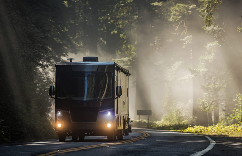 Class A driving through CA redwood forest