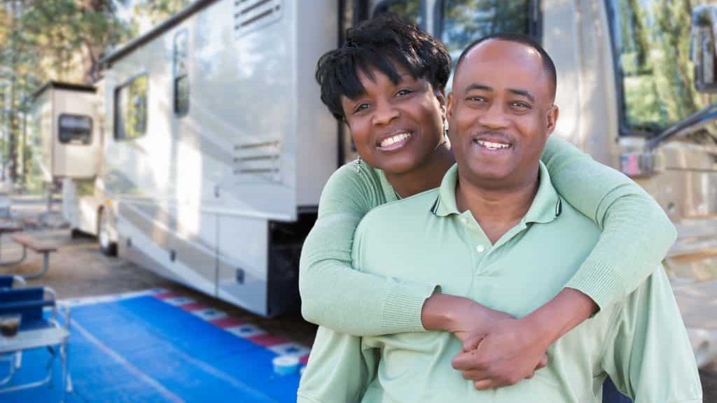 happy couple outside camper