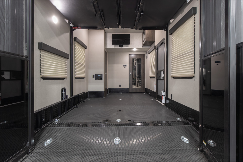 the back of a toy hauler 5th wheel- showing lots of cargo space