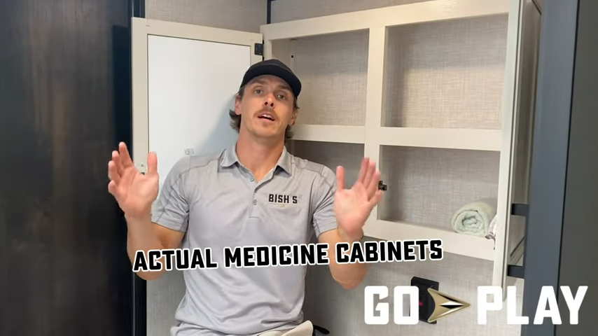 Man from Bish's RV showing off a medicine cabinet for Go Play RVs