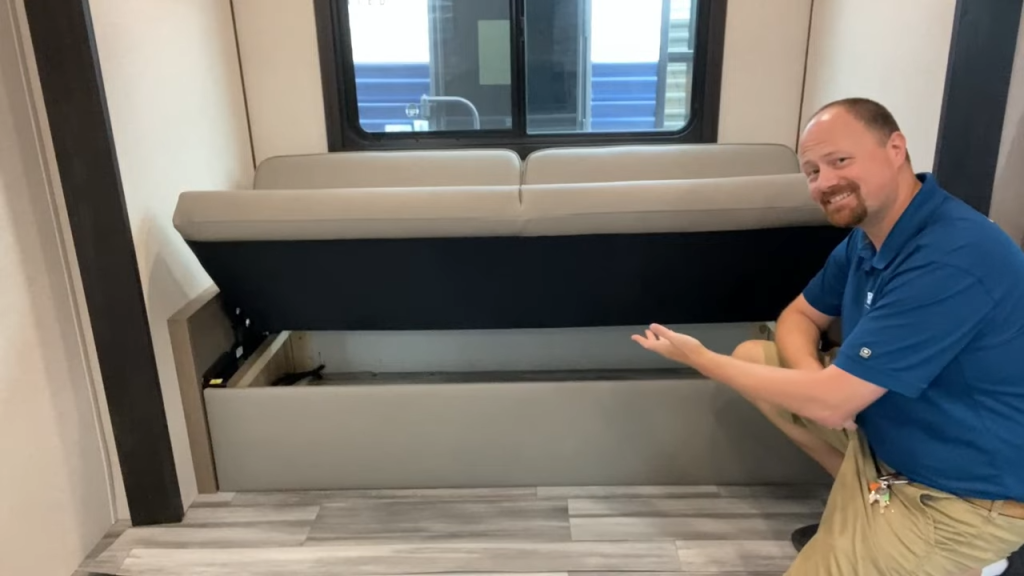 Josh the RV Nerd showing off sofa storage in 20FBS