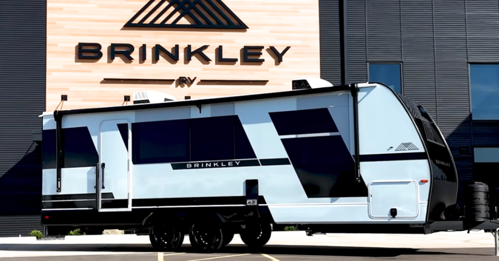 Brinkley Model I outside Brinkley RV headquarters sign