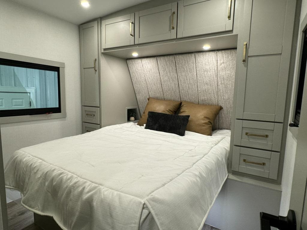 Private Bedroom with storage cabinets and wardrobe