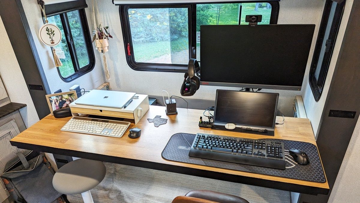 office insdie an RV set up with two monitors and printer