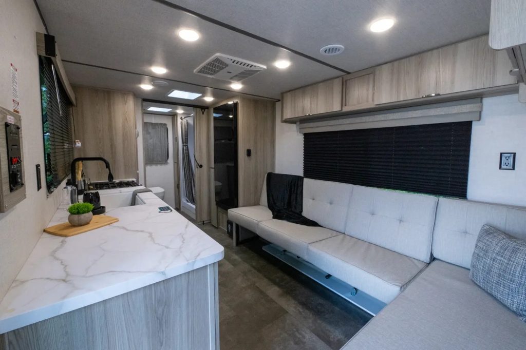 Kitchen and bench seat inside the Wildwood FSX 233RBLE