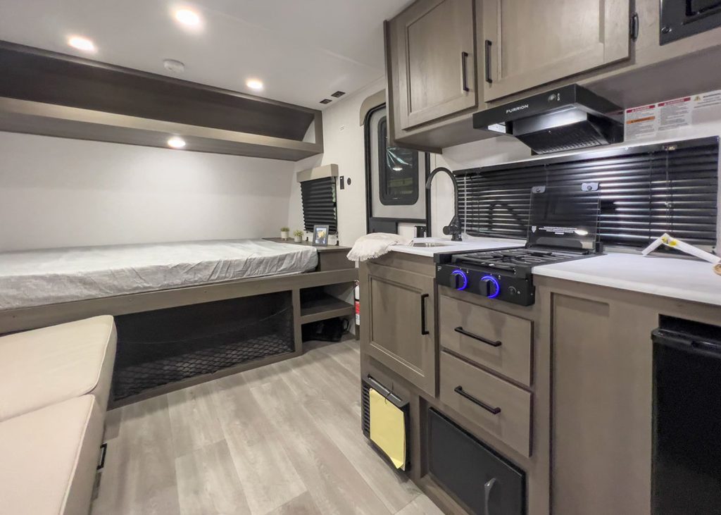 Kitchen and bed inside Grand Design Transcend One 151BH