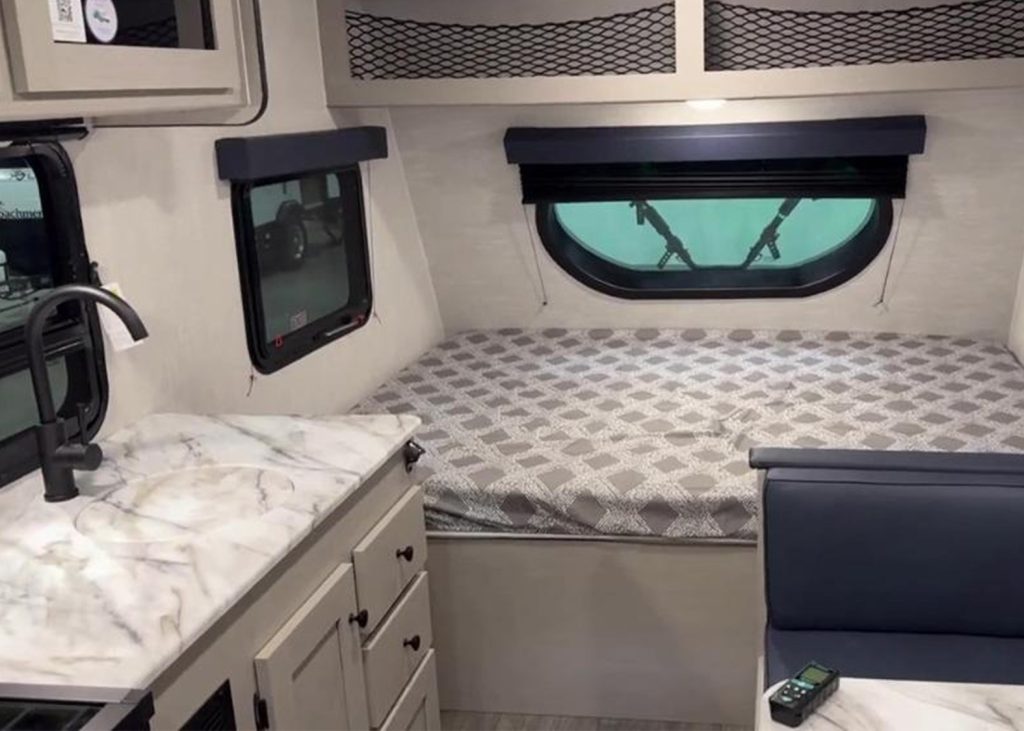Bed and Kitchen inside Coachmen Apex Remote 15R