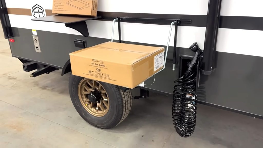 Hose and exterior grill outside R-Pod 153