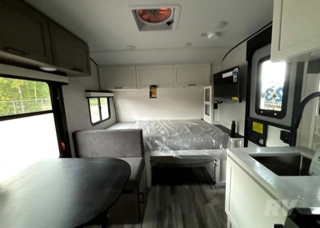 bed and living area inside Jayco Fay Feather Micro 171BH