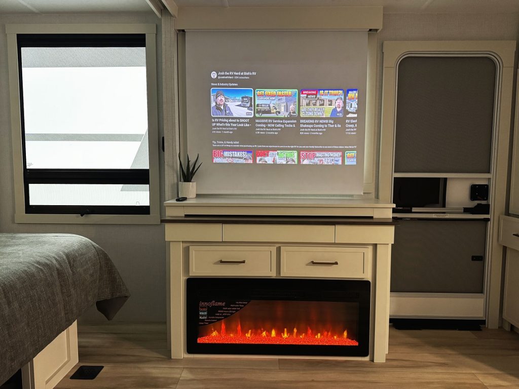 Fireplace and projection screen inside Brinkley I 235