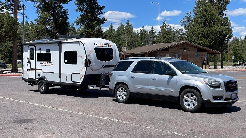 SUV pulling a Geo Pro