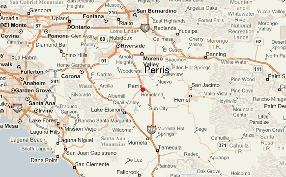 A detailed road map of Southern California centered on Perris, showing nearby cities including Riverside, Moreno Valley, Corona, San Bernardino, and Temecula, with major highways such as I-215, I-15, and I-10 marked clearly, along with surrounding mountain ranges and local points of interest.