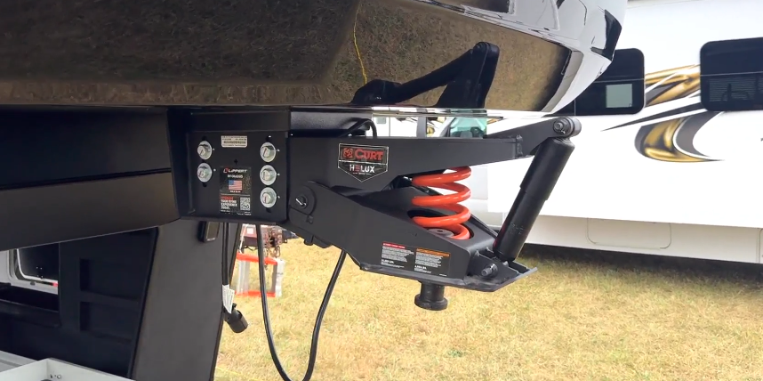 CURT Helux pin box with upgraded suspension system on the Axiom Imperium 12900 fifth wheel RV, designed for smoother towing and improved ride stability.