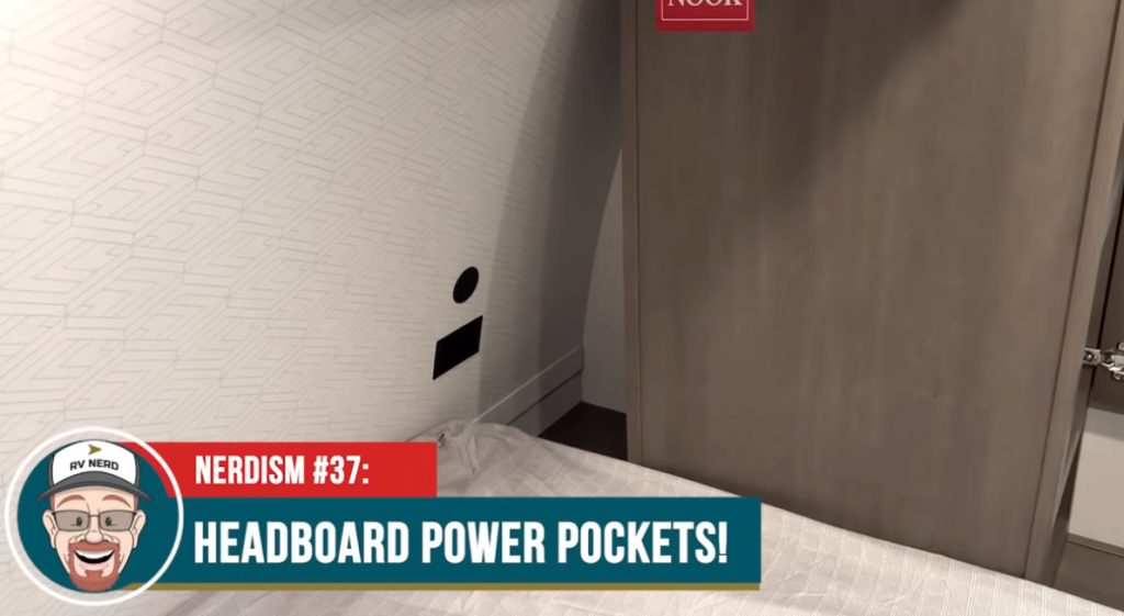 Grand Design Transcend Xplor 22RBX bedroom headboard with built-in power pockets for device charging, highlighted in RV Nerdism #37 video segment.
