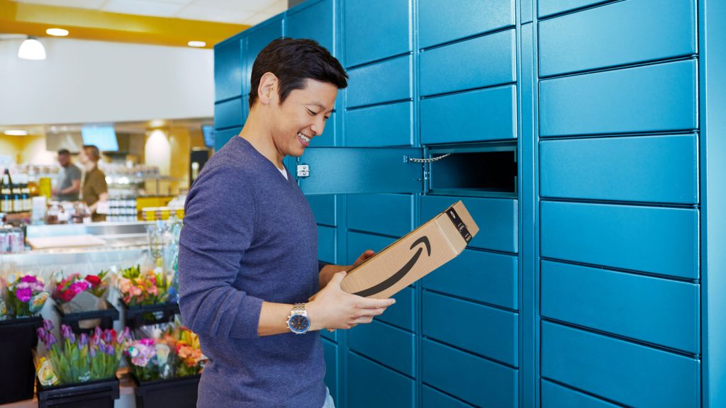 RVer picking up an Amazon Locker package inside a grocery store—easy mail and package solution for full-time RV travelers.
