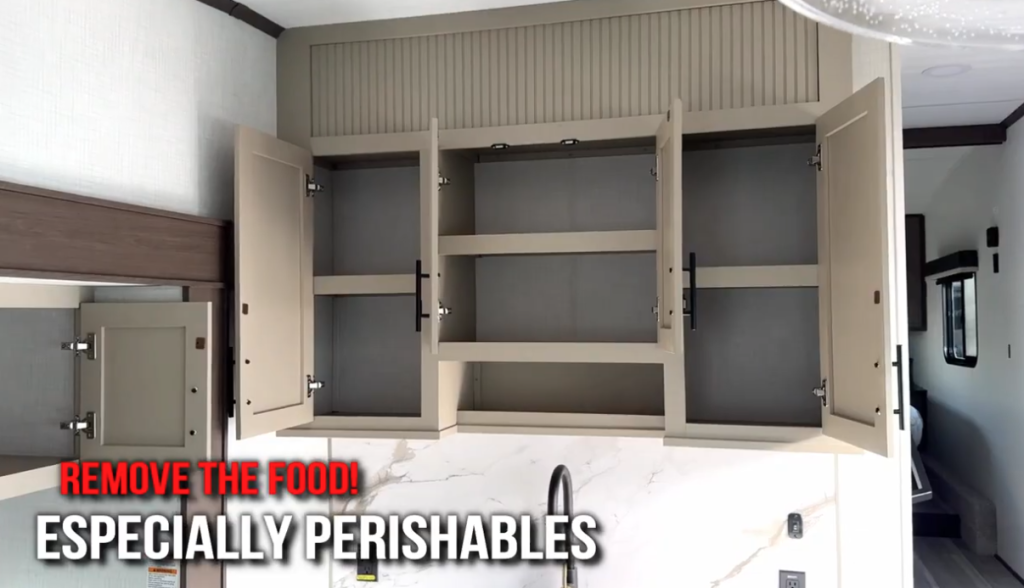 Open RV kitchen cabinets with "Remove the Food! Especially Perishables” text overlay — emphasizing the importance of clearing out food before winter storage to prevent pests and odors.