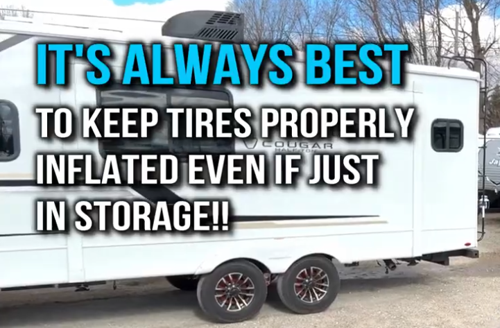 Side view of a Cougar travel trailer with bold overlay text reading “It’s Always Best to Keep Tires Properly Inflated Even If Just in Storage!!” — emphasizing proper RV tire maintenance during long-term storage.