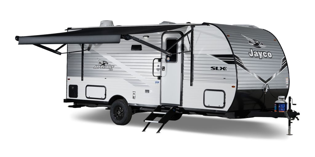 Jayco Jay Flight SLX travel trailer with awning extended, featuring single axle design, front aerodynamic profile, and modern exterior graphics.