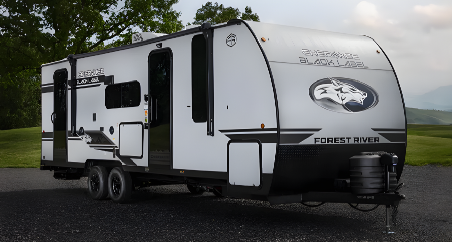 Forest River Cherokee Black Label travel trailer exterior featuring aerodynamic front cap, dual axles, slide-out, and modern black-and-white graphics.