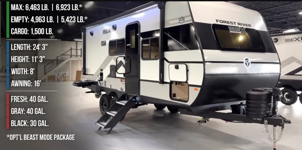 Forest River IBEX travel trailer on display with weight and tank capacity specs listed