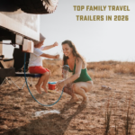 Mother and child playing with water beside a travel trailer outdoors, with text overlay reading “Top Family Travel Trailers in 2026.