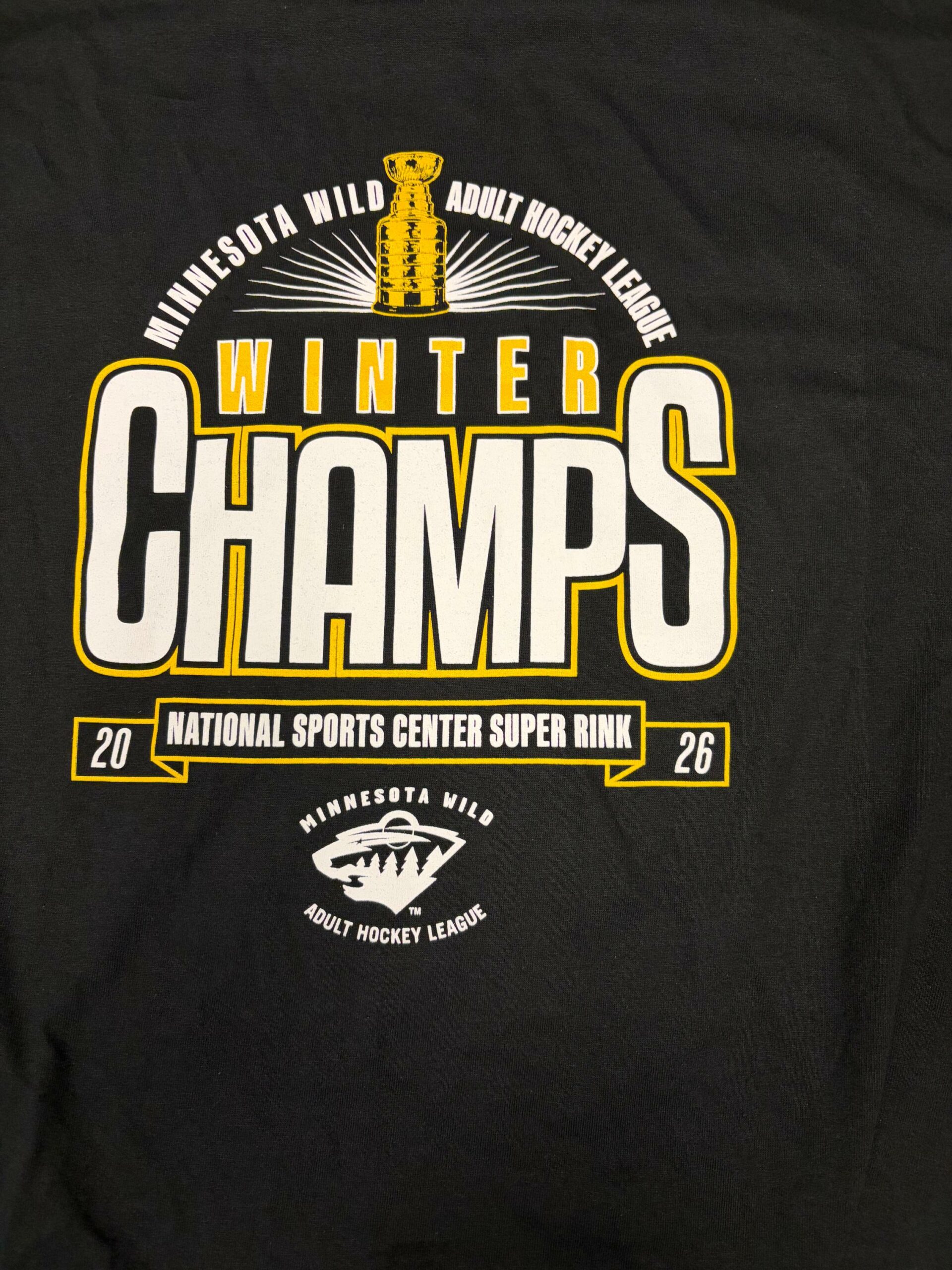 Hilltop Hockey Club 2026 championship T-shirt commemorating the team's title win.