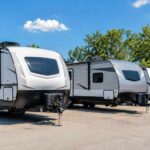 Bunkhouse travel trailers in Michigan at a summer RV dealership