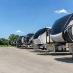 Fifth wheels in Michigan lined up at a summer RV dealership